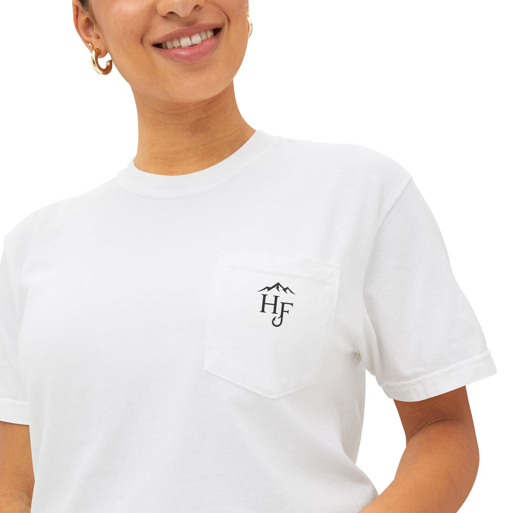 Close-up of white unisex outdoor pocket tee with small Hippie Fishy logo, designed for fishing, camping and outdoor lifestyle.